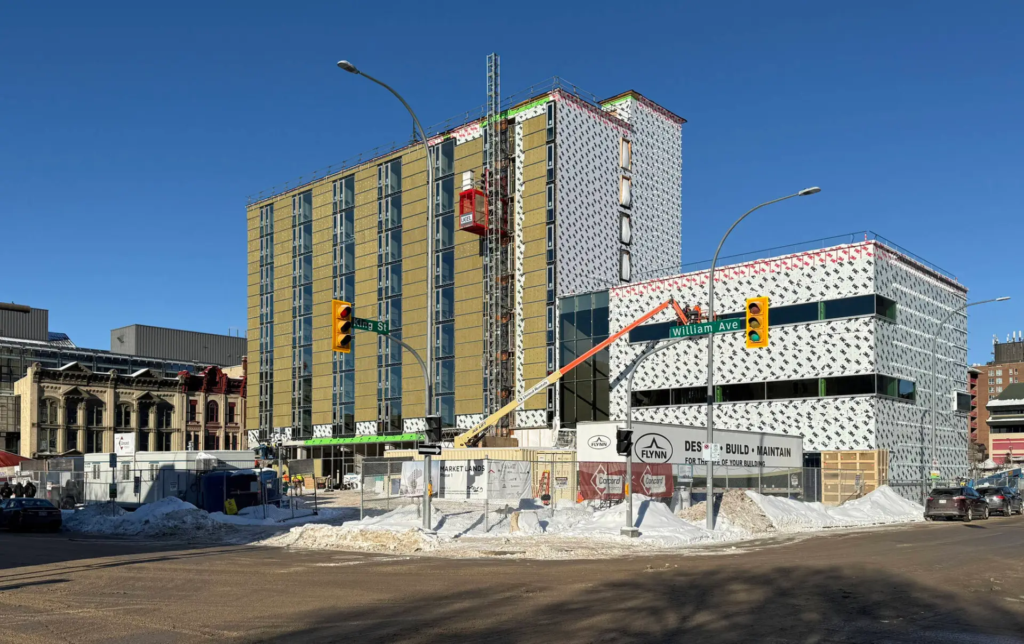 A photograph of the Market Lands South building under construction. 